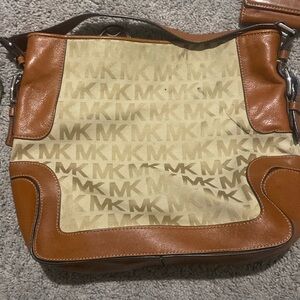 Michael Kors condition has a black stain, but it is removable